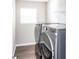 Laundry room with modern washer and dryer at 2400 Oakmont Dr, Plainfield, IN 46168