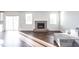 Living room with hardwood floors, fireplace, and sliding glass doors at 2400 Oakmont Dr, Plainfield, IN 46168