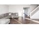 Spacious living room with hardwood floors and L-shaped sofa at 2400 Oakmont Dr, Plainfield, IN 46168