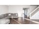 Spacious living room with hardwood floors and L-shaped sofa at 2400 Oakmont Dr, Plainfield, IN 46168