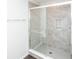 Clean shower with gray tile and glass enclosure at 2400 Oakmont Dr, Plainfield, IN 46168
