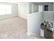 Spacious upper level with carpeted floors and a view of the living room below at 2400 Oakmont Dr, Plainfield, IN 46168