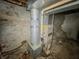 Unfinished basement with exposed pipes and furnace at 2439 N Kenwood Ave, Indianapolis, IN 46208