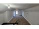 Spacious attic bedroom with carpeted floor and window at 2640 E Midland Rd, Indianapolis, IN 46227