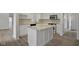 White kitchen with granite countertops and island at 3039 River Bay N Dr, Indianapolis, IN 46240