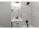 Updated bathroom with marble tile shower and modern vanity at 3180 Graceland Ave, Indianapolis, IN 46208