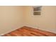 Bedroom with hardwood floors and window at 3322 N Whittier Pl, Indianapolis, IN 46218