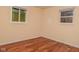 Spacious bedroom with hardwood floors and large windows at 3322 N Whittier Pl, Indianapolis, IN 46218