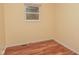Bedroom with hardwood floors and window at 3322 N Whittier Pl, Indianapolis, IN 46218