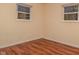 Bedroom with hardwood floors and large windows at 3322 N Whittier Pl, Indianapolis, IN 46218
