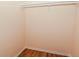 Empty closet with wood flooring, white shelf, and rod at 3322 N Whittier Pl, Indianapolis, IN 46218