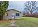 Ranch home with front yard and landscaping at 3322 N Whittier Pl, Indianapolis, IN 46218