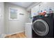 Clean laundry room with washer, dryer, and storage at 3334 Eden Village Pl, Carmel, IN 46033