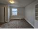 Cozy bedroom with grey carpet and built-in shelves at 3687 E 800 N, Alexandria, IN 46001