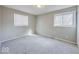 Simple bedroom featuring neutral walls, carpet, and a window with blinds at 3867 Richelieu Rd, Indianapolis, IN 46226