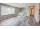 Spacious living room featuring hardwood floors and a bay window at 3867 Richelieu Rd, Indianapolis, IN 46226