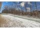 Backyard with light snow cover and wooded area at 3923 Holly Brook Dr, Westfield, IN 46062