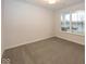 Bright bedroom with carpeted floor and large window at 3923 Holly Brook Dr, Westfield, IN 46062