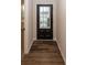 Bright entryway with dark hardwood floors and a black front door at 3923 Holly Brook Dr, Westfield, IN 46062