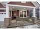 Covered front porch with brick columns and recessed lighting at 3923 Holly Brook Dr, Westfield, IN 46062