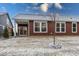 Rear view of house with red siding and patio at 3923 Holly Brook Dr, Westfield, IN 46062