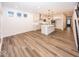 Modern kitchen with island, stainless steel appliances, and hardwood floors at 3923 Holly Brook Dr, Westfield, IN 46062