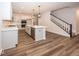 Open concept kitchen with island, stainless steel appliances, and hardwood floors at 3923 Holly Brook Dr, Westfield, IN 46062