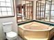 Bathroom with corner jacuzzi tub and wood framed mirror at 4726 E 210 N, Lebanon, IN 46052