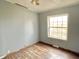 Simple bedroom with light gray walls and wood-look floors at 4726 E 210 N, Lebanon, IN 46052