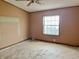 Bedroom with ceiling fan and window at 4726 E 210 N, Lebanon, IN 46052