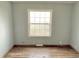 Bright bedroom featuring a window and laminate wood floor at 4726 E 210 N, Lebanon, IN 46052