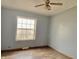Simple bedroom with light gray walls and wood-look floors at 4726 E 210 N, Lebanon, IN 46052