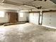 Spacious three-car garage with concrete floor at 4726 E 210 N, Lebanon, IN 46052