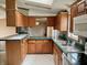 Spacious kitchen with wood cabinets and a tiled countertop at 4726 E 210 N, Lebanon, IN 46052
