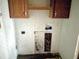 Small laundry room with wood cabinets and space for washer/dryer at 4726 E 210 N, Lebanon, IN 46052