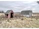 Red doghouse and white shed in a grassy field at 4726 E 210 N, Lebanon, IN 46052
