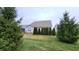 Spacious backyard with lawn and privacy trees at 4865 Dahlia Dr, Plainfield, IN 46168