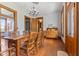 Charming dining room with hardwood floors, antique buffet, and farmhouse-style table at 7955 W 400 N, Boggstown, IN 46110