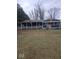 House with covered porch, American flag, and grassy yard at 8222 W 875 S, Pendleton, IN 46064