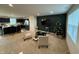 Open concept living room and kitchen with a dark green accent wall at 883 Woodbridge Way, Lebanon, IN 46052