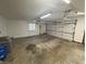 Attached garage with overhead door and storage at 1028 S Country Ln, Greenfield, IN 46140