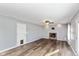 Living room with fireplace and hardwood floors at 1028 S Country Ln, Greenfield, IN 46140