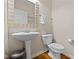 Convenient powder room with pedestal sink and toilet at 11575 Reagan Dr, Fishers, IN 46038