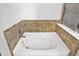 Main bathroom features a jetted tub and tile surround at 2034 Buckthorn Dr, Columbus, IN 47201