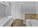 Bathroom boasts a relaxing jetted tub and double vanity at 2034 Buckthorn Dr, Columbus, IN 47201