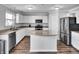 Modern kitchen with white cabinets and stainless steel appliances at 2034 Buckthorn Dr, Columbus, IN 47201