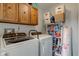 Laundry room with washer, dryer, and shelving at 2856 Jamieson Ln, Indianapolis, IN 46268