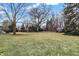 Spacious backyard with mature trees and shed at 4621 N Meridian St, Indianapolis, IN 46208