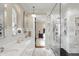 Spa-like bathroom with marble shower, double vanity, and a view of the bedroom at 4621 N Meridian St, Indianapolis, IN 46208