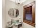 Elegant powder room with granite vanity and decorative mirror at 4621 N Meridian St, Indianapolis, IN 46208
